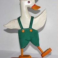 schöne alte weiße Ente aus Holz mit der grünen Hose, Spielzeug, Holzspielzeug