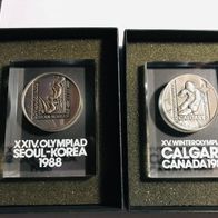 2 Silbermedaillen Olympiad Seoul & Calgary 1988, 999, im Acrylblock, m. Zertifikat
