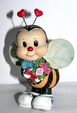 kleine niedliche Wespe mit Blumenstrauß, Dekoration
