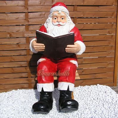 Weihnachtsmann mit Buch als Dekofigur und Statue für Ihre Außendekoration.