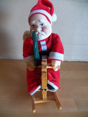 Figur Weihnachtsmann Nikolaus auf einem Schaukelpferd ca. 21cm