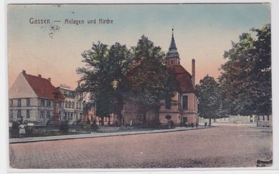 81029 AK Gassen - Anlagen und Kirche mit Denkmal um 1910
