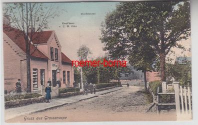 77149 Ak Gruss aus Großenaspe Dorfstrasse mit Kaufhaus J.H. Otto um 1910