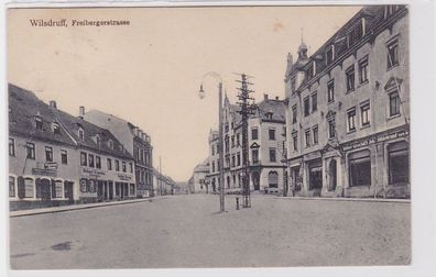 91582 AK Wilsdruff - Freibergerstrasse, Straßenansicht mit Geschäften 1912