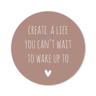 Mauspad - Englisches Zitat "Create a life you can't wait to wake up to" vor einem bra