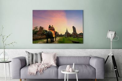 Leinwandbilder - 140x90 cm - Reiten auf einem Elefanten (Gr. 140x90 cm)
