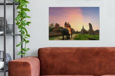 Leinwandbilder - 90x60 cm - Reiten auf einem Elefanten (Gr. 90x60 cm)