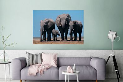 Glasbilder - 120x80 cm - Vier Elefanten unter einem blauen Himmel (Gr. 120x80 cm)