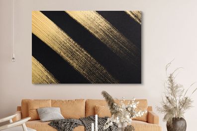 Leinwandbilder - 150x100 cm - Goldene Farbstreifen auf schwarzem Hintergrund