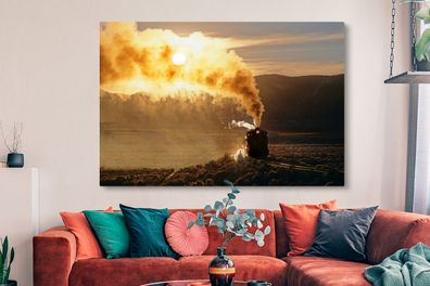 Leinwandbilder - 150x100 cm - Ein Sonnenuntergang hinter der Dampflokomotive