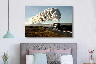 Leinwandbilder - 150x100 cm - Eine Dampflokomotive fährt durch eine zerklüftete Lands