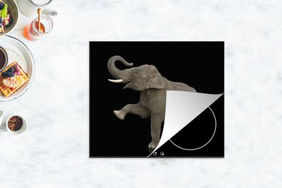 Herdabdeckplatte - 60x52 cm - Elefant mit dem rechten Bein nach oben auf schwarzem Hi