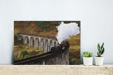 Glasbilder - 30x20 cm - Eine Dampflokomotive über eine charakteristische Brücke