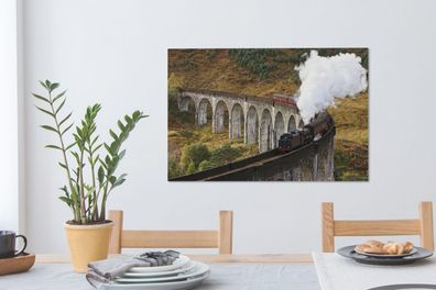 Leinwandbilder - 60x40 cm - Eine Dampflokomotive über eine charakteristische Brücke