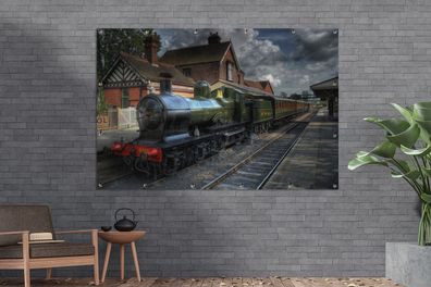 Gartenposter - 180x120 cm - Eine Dampflokomotive in einem malerischen Dorf