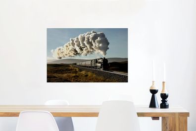 Glasbilder - 90x60 cm - Eine Dampflokomotive fährt durch eine zerklüftete Landschaft