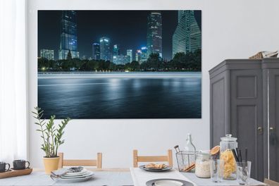 Leinwandbilder - 150x100 cm - Beleuchtete Wolkenkratzer in der Nacht von Shanghai