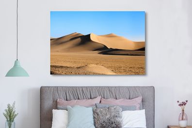 Leinwandbilder - 150x100 cm - Eine große Sanddüne in einer Wüste (Gr. 150x100 cm)