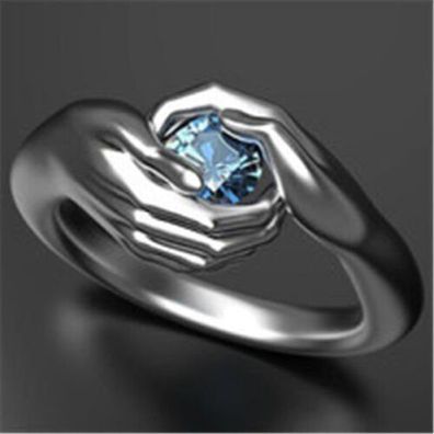 Niedlicher Hände Damen Ring mit blauen Zirkonia Stein