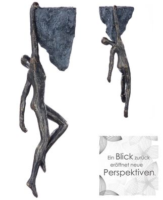 Gilde Hänger Skulptur "Rückblick" bronzefarben, hängend am grauen Stein mit Hängev...