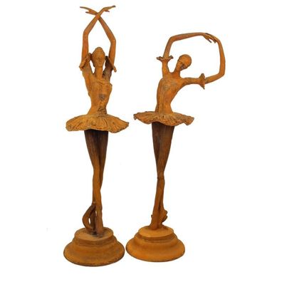 A PAIR OF RUSTY CAST IRON DANCER Statues