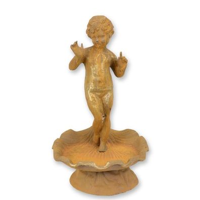 A RUSTY CAST IRON PUTTO BIRD BATH