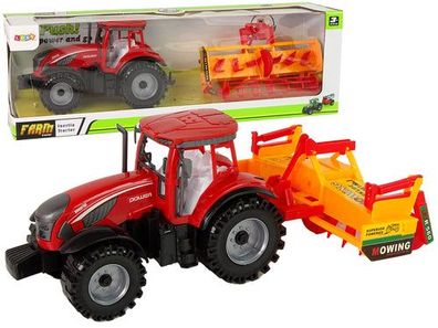 Roter Traktor mit orangefarbenem Grubberantrieb