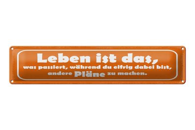 Blechschild Spruch 46x10 cm Leben ist das, was passiert, während du