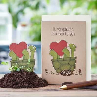 Grußkarte â€?Mit Verspätungâ€? â€? Pflanzbare Karte mit Saatstecker & Blumensamen â€?