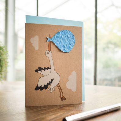 Geburtskarte â€?Storch, blauâ€? â€? Pflanzbare Grußkarte aus Saatpapier mit Wildblume