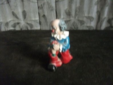 Gilde Clown mit rote Blumen