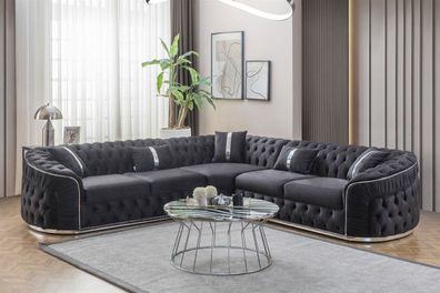 Schwarzer Ecksofa mit silbernen Elementen und geschwungenen Armlehnen
