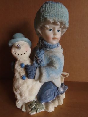 Figur Winterdeko Kind mit Schneemann Kleidung Blautöne ca. 20,5cm H