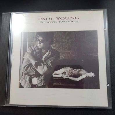 PAUL YOUNG between two fires CH VG+/EX (CD Album, Pop, CBS)
