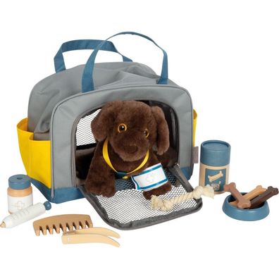 Hund mit Tasche und Pflege-Set