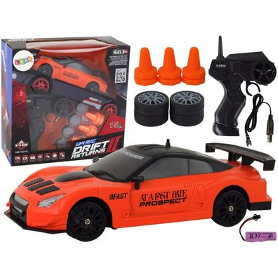LeanToys Ferngesteuertes Sportauto R/C 1:24 Orange mit wechselbaren Rädern