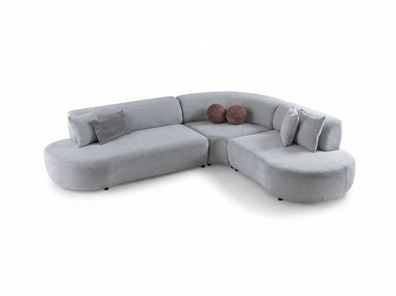 Graues Ecksofa mit geschwungener Form und Stoffbezug (BD)